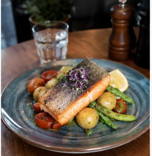 Grilled salmon with roasted potatoes and vegetables at Spargo’s Café + Bar