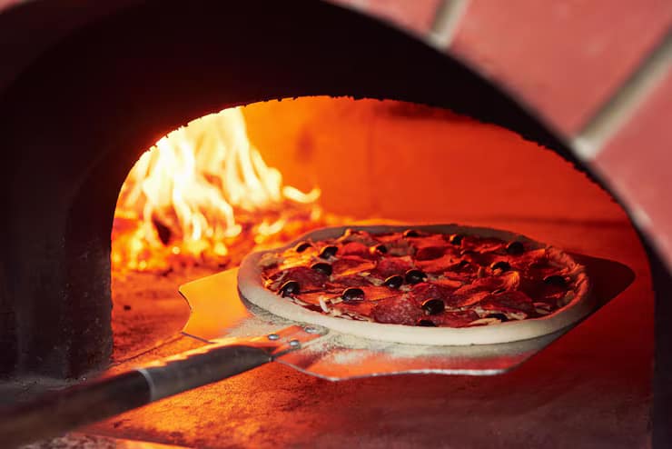Gourmet wood fired pizza in Adelaide with crispy crust, fresh basil, and smoky oven flavour.